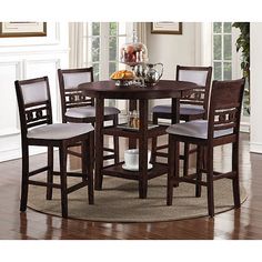 a round table with four chairs around it