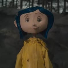 an animated doll with blue hair wearing a yellow jacket and standing in front of trees