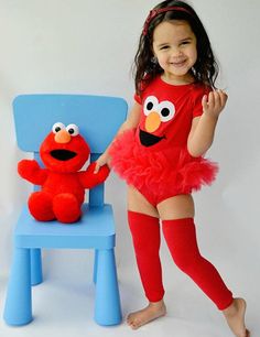 This cute Elmo inspired tutu onesie features Elmos cute face and bright red tulle sewn around the bodysuit forming a pretty ballerina style tutu. Red leg warmers are included. Sizes available: 12-18 Months 18-24 Months Please allow 7-10 business days for your order to ship. Thank you Elmo Costume Toddler, Elmo Outfit, Elmo Costume, Elmo First Birthday, Toddler Leg Warmers, Red Monster, Elmo Birthday Party, Sesame Street Birthday Party, Elmo Party