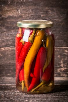 red and yellow peppers in a glass jar