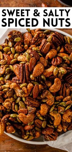 sweet and salty spiced nuts in a white bowl on a wooden table with text overlay