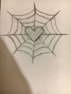 a drawing of a spider web with a heart on it