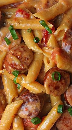 pasta with sausage, peppers and sauce in a bowl