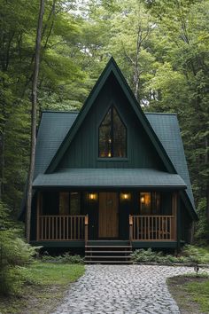 a small cabin in the woods with a stone walkway leading up to it's front door