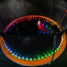 Light up your trampoline in a rainbow of ways with Bouncebrightz. With 3 settings, there is no end to the colors you will see as you bounce. The Color Morphing setting cycles through a variety of colors all on its own. For the Color Select setting, let the lights keep morphing until you see a color you like, then push the power button to stop it on that color. Push the button a third time to activate Color Jump. Every time you jump, the lights change color. Compatible with trampolines up to 15-f Trampoline Lights, Trampoline Room, Trampoline Party, Family Backyard, Indoor Trampoline, Method Homes, Led Tube Light, Backyard Play, Trampolines