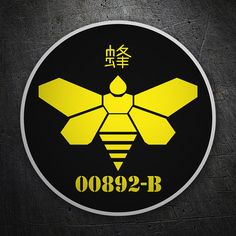 a black and yellow sticker with a bee on it