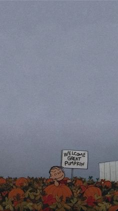 there is a sign that says welcome to pumpkins in front of a field with leaves