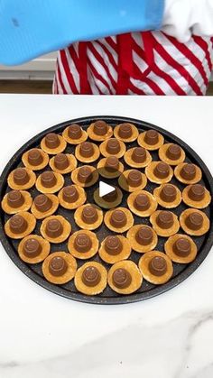 a pan filled with cookies sitting on top of a counter