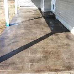 a patio that has been cleaned and is in the process of being used as a walkway