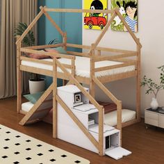 there is a bunk bed with stairs to the top and bottom, next to a painting on the wall