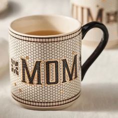 a coffee mug with the word mom on it