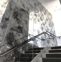 the stairs are made of marble and metal