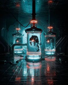 three glass jars filled with liquid in a dark room