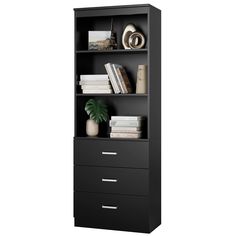 a black bookcase with three drawers and two books on the bottom shelf next to a potted plant