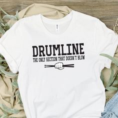 Drumline, Band shirt, Marching band season, With the band, Marching band mom, Drum line mom, drumline mom, marching band tee shirts, t shirt It's marching band season!!  Excited to offer these cute and sassy drumline tees.  Each shirt is custom made to order featuring the wording 'Drumline the only section that doesn't blow'. Each shirt is made to order in your choice of white, silver or heathered tee. Please understand, these are 100% polyester & the true white may be somewhat more translucent Drum Mom Shirts Ideas, Marching Band Brother Shirt, Funny Marching Band Shirts, Disney Marching Band Trip Shirts, Drumline Mom Shirts, Marching Band Fundraiser Ideas, Marching Band Shirts Ideas, Band Camp Outfits