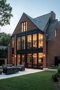 a large brick house with lots of windows