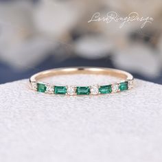 Lab Emerald Wedding Band Women Vintage 14K Yellow Gold Lab Emerald and Diamond Moissnaite Baguette Cut Half Eternity Stackable Matching Ring Height/Thickness of the ring at the top: about 1.3mm Metal Type: Solid 14K Gold Size: US3-10 Side Stone: Lab Emerald & Moissanite √ CUSTOM √ LAYAWAY √ ENGRAVING √ GIFT WRAPPING & more: https://www.etsy.com/shop/LoveRingsDesign/items?ref=seller-platform-mcnav§ion_id=21110007 All our jewelry is 100% authentic. Please check the availability of selected gems an Emerald And Diamond Anniversary Band, Emerald Stack Ring, Wedding Rings With Emerald Accents, Emerald Green Wedding Band With Engagement Ring, Emerald Stackable Ring, Wedding Band With Colored Stones, Emerald And Diamond Eternity Band, Emerald And Diamond Wedding Ring, Emerald Anniversary Ring