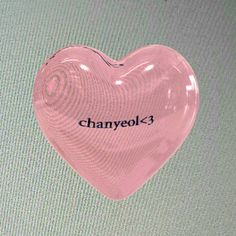 a pink heart shaped object with the word chanyeok - 3 written on it