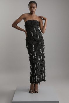 Fall '24: Allow Our Latest Collection Of Autumn Pieces To Inspire You For The Season Ahead. Feel Elegant In Our Midi Dress, Made With Uniquely Textured Fabric, With A Fitted Silhouette That Flaunts The Figure, And Sparkling Crystal Detailing. Style This Dress With Pointed Toe Heels For An Outfit That Will Turn Heads From Evening Plans To Party Nights. Crystal Embellished Textured Jacquard Bandeau Tailored Midaxi Dress High Quality Textured Jacquard Fabric Formal Fitted Silhouette Sparkling Crystal Embellishments Bandeau Neckline Figure Hugging Silhouette Flattering Midi Length Thigh High Leg Split In Back Zip Back Fastening Black Embellished Dress, Sparkly Bridesmaids, Leg Split, Hugging Silhouette, Midaxi Dress, Petite Coat, Fall 24, Embellished Gown, Fall Outfits For Work