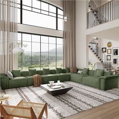 a living room filled with lots of furniture and large windows overlooking a field in the distance