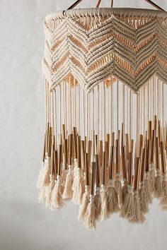 a macrame chandelier hanging on a wall