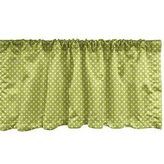 the green and white polka dot valance is hanging on a curtain rod with an attached tie