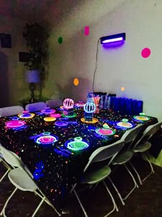 the table is covered with bright lights and decorations for a party or special occasion to celebrate