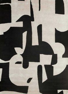 a black and white rug with different shapes