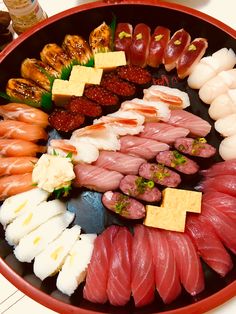 an assortment of sushi is displayed in a bowl