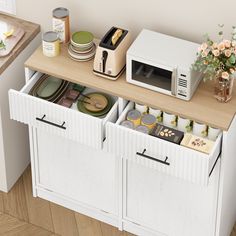 a microwave sitting on top of a kitchen counter next to some plates and pans