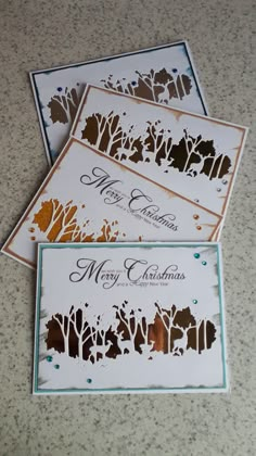 three wedding cards with trees on them