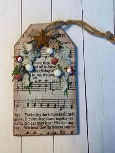 a wooden tag decorated with ornaments and music notes