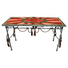 an ornately decorated table with tassels and bells on it's legs