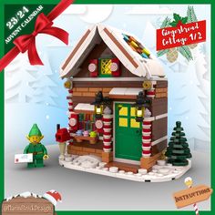 a lego christmas house with lights and decorations on the front, next to a small elf figurine