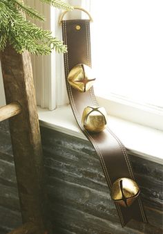 a window sill with two bells on it