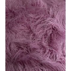 a close up view of the texture of an animal fur material, in shades of purple