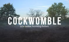 the words cockwomble are in front of some trees