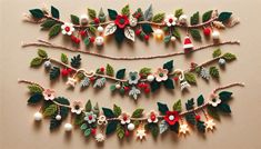 some christmas decorations are hanging on the wall with string and bells attached to them,