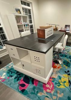 a desk with a computer on top of it