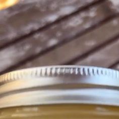 a close up of a mason jar on a wooden table