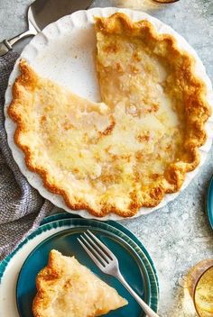 a piece of pie sitting on top of a plate next to a fork and knife