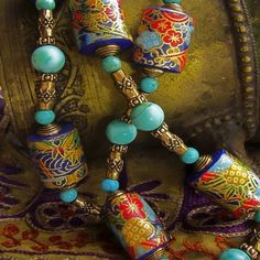 the necklace is decorated with colorful beads