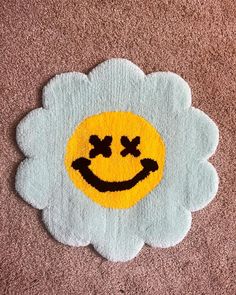 a smiley face rug on the floor