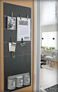 a calendar hanging on a wall in a living room