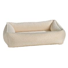 the dog bed is made out of fleey material and has a long, rectangular shape