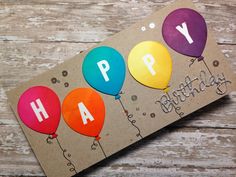 a birthday card with balloons and the words happy birthday written on it in multicolored paper