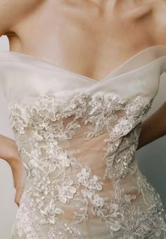 the back of a woman's dress with flowers on it