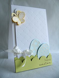 an easter card with two eggs and a butterfly