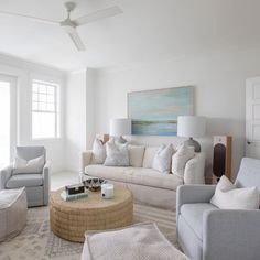 a living room filled with furniture and white walls