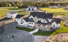 an aerial view of a large white house